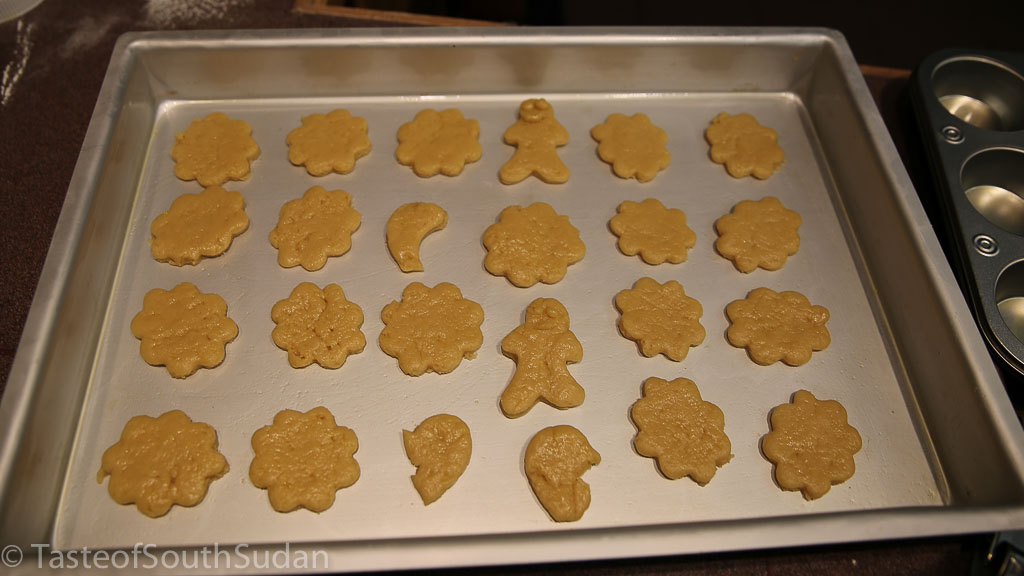 Christmas cookies dough in the shape of flowers, halfmoons and gingerbread man