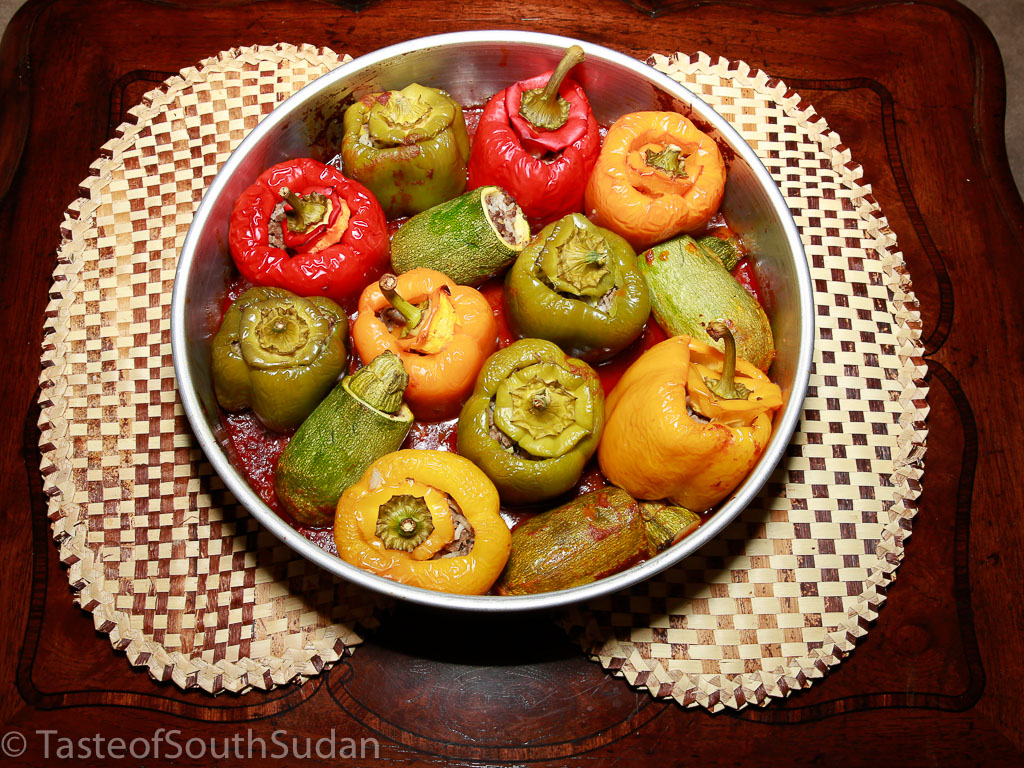 Mahshi, roasted stuffed zucchini and bell peppers, in a bed of tomato sauce. South Sudan cuisine, Mediterranean cuisine, Sudanese food.