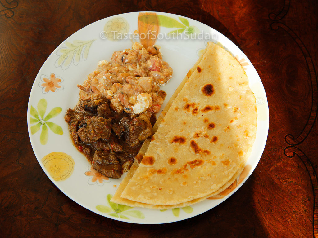 Chapati served with Ful medames and beef stew. Taste of South Sudan, East African Chapati, Kenyan chapati, indian flat bread